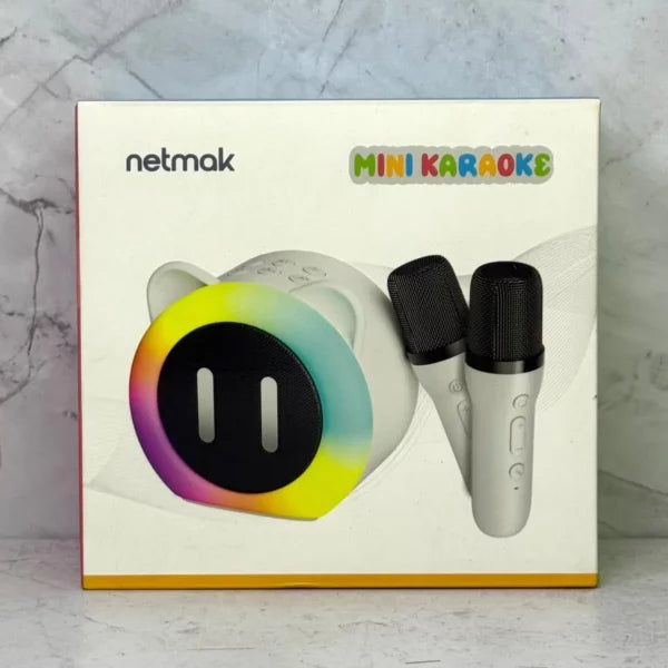 Parlante Mini Karaoke Netmak + 2 micrófonos